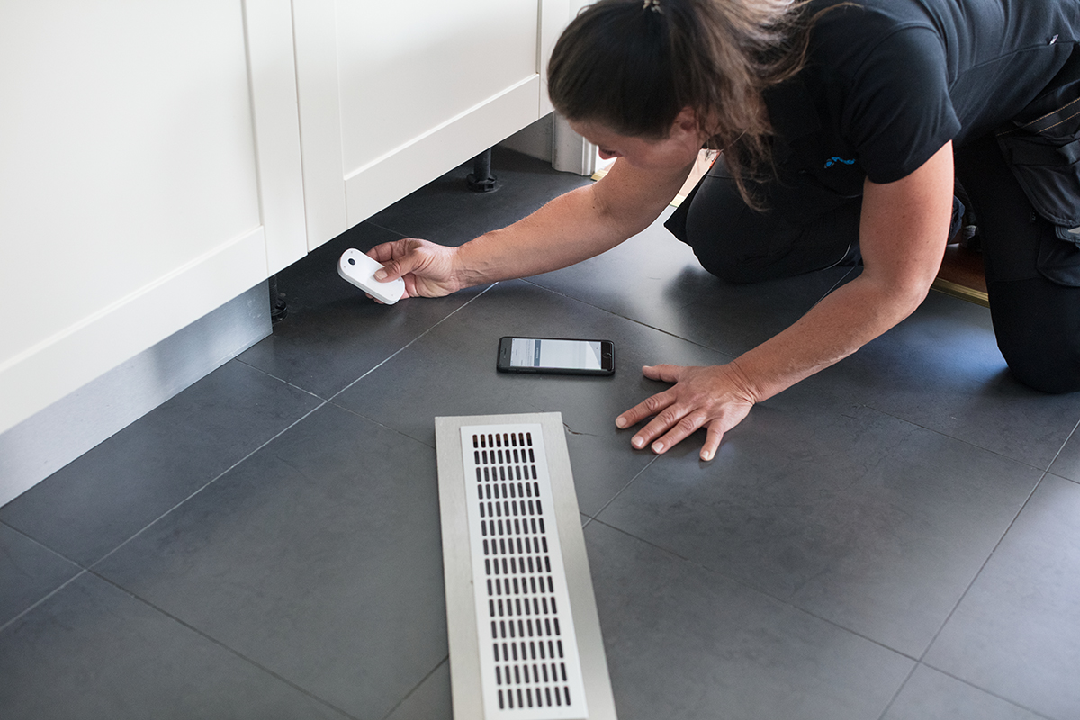 Polygon property damage prevention specialist setting up smart sensors to avoid water damage.